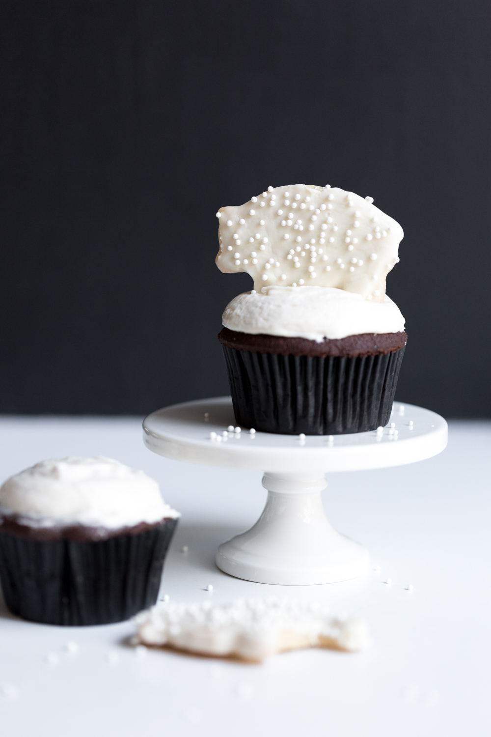 Top each cupcake with a frosted animal cookie.