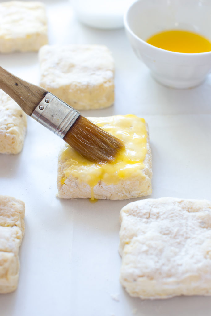 Brush the tops of the shortcakes with melted butter.