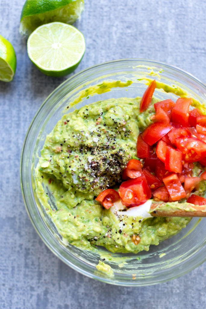 Mixing guacamole from scratch.