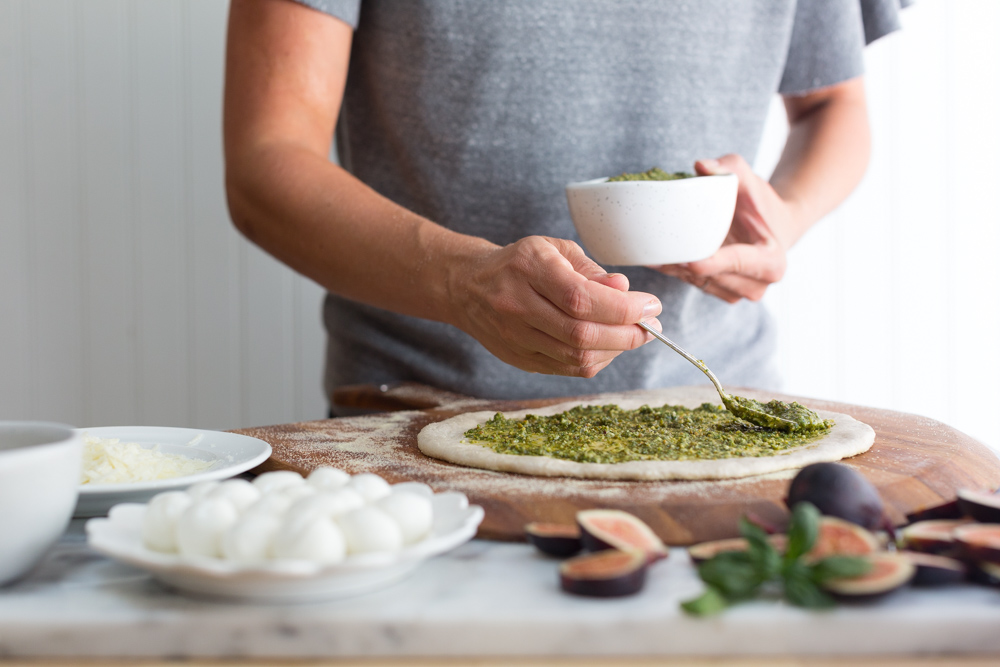 Topping pizza with Pistachio Pesto