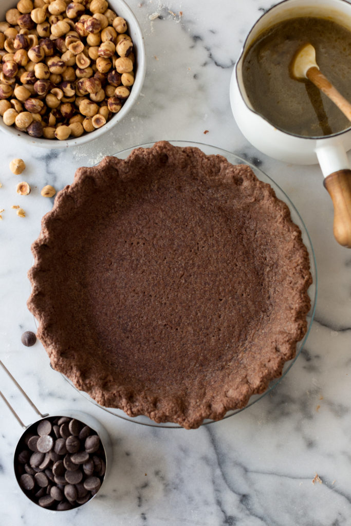 Chocolate Hazelnut Maple Bourbon Pie blind baked shell.