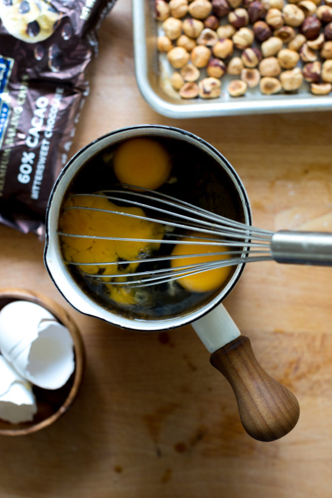 whisking eggs into filling