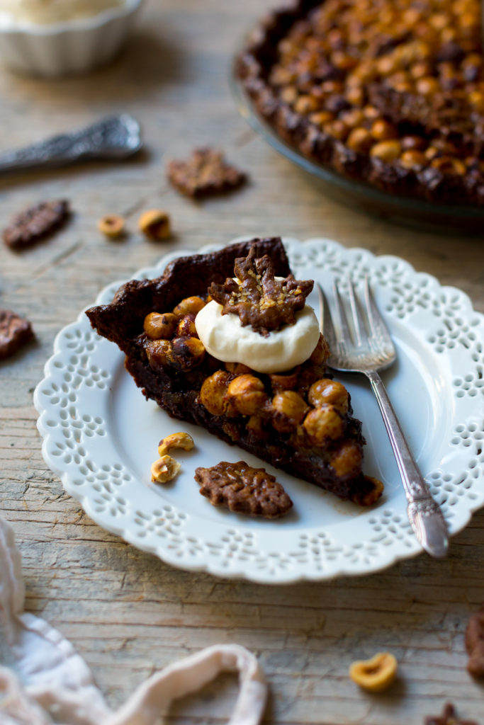 Chocolate Hazelnut Maple Bourbon Pie slice with whipped cream
