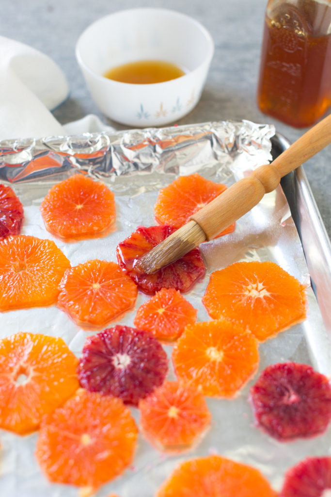 brushing orange slices with honey before broiling