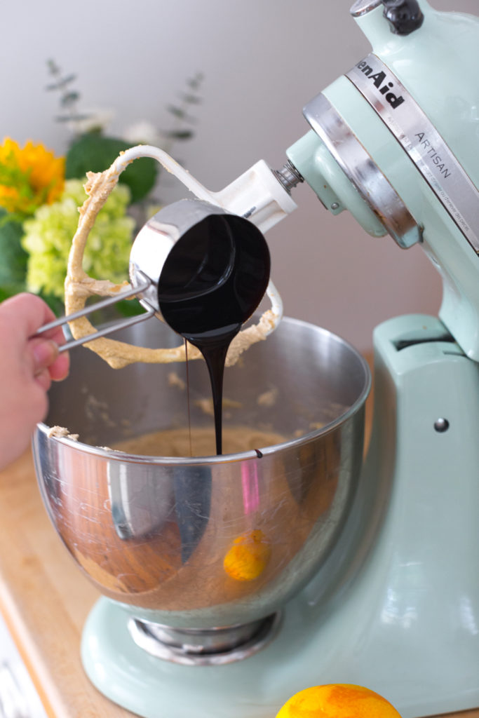 adding molasses to cookie dough