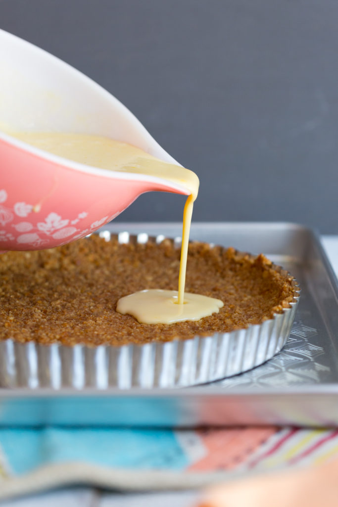 Grapefruit Margarita Tart filling pouring into Pretzel Crust