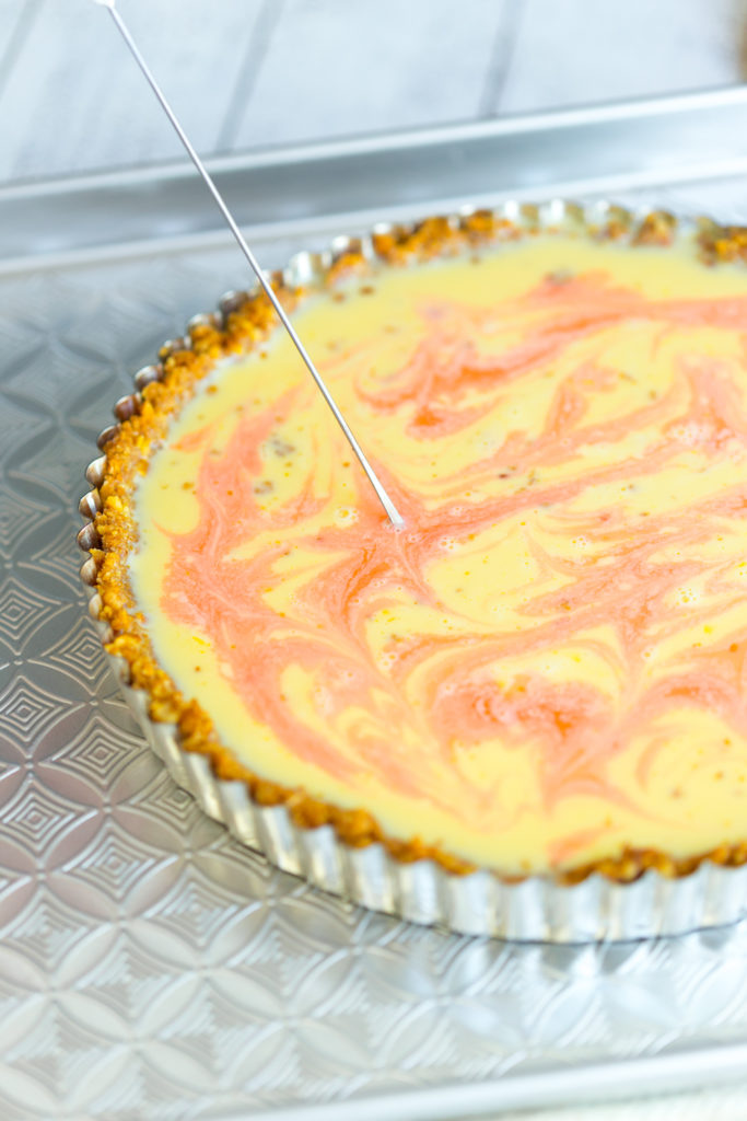 Grapefruit Margarita Tart with Pretzel Crust - swirling in Campari