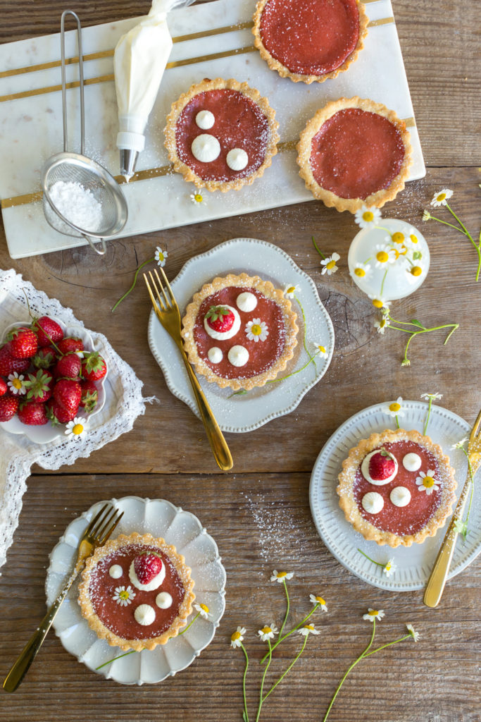 Topping Strawberry Rhubarb Curd Tartlets with creme fraiche
