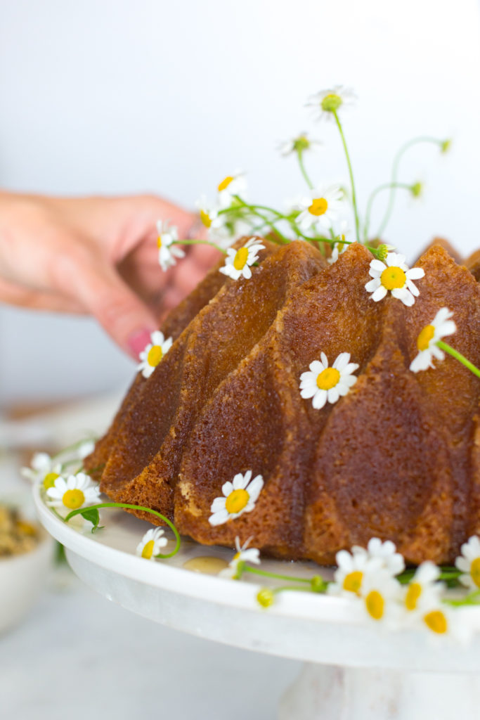 Becky Sue dressing the lemon bundt cake