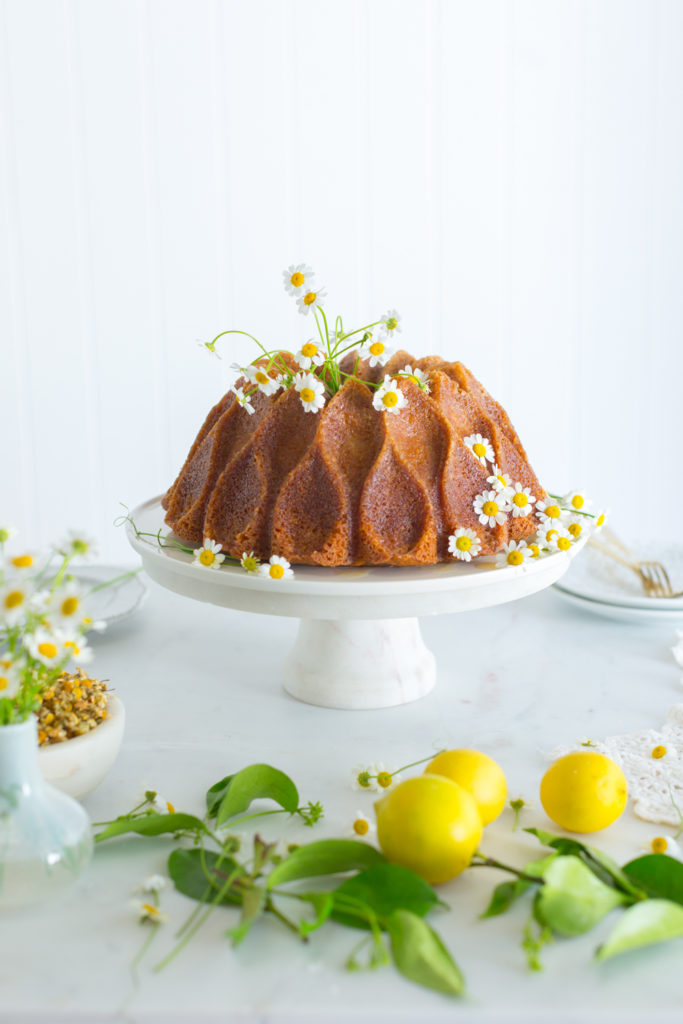 Lemon Chamomile Honey Bundt Cake on a stand