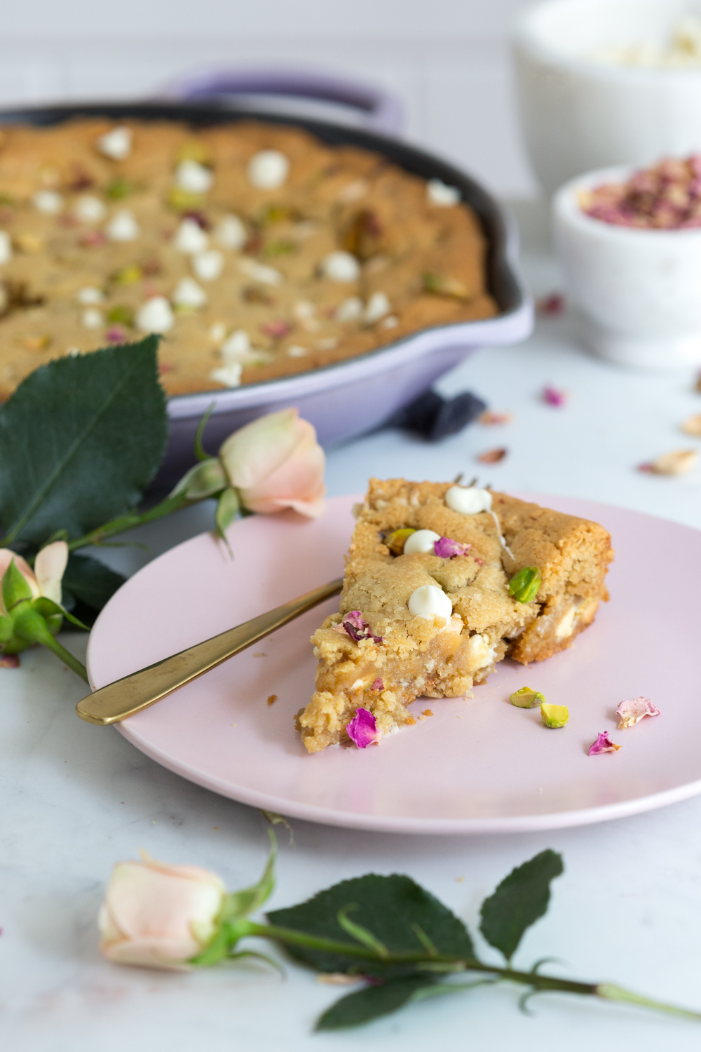 Tahini Pistachio White Chocolate Rose Skillet Cookie slice