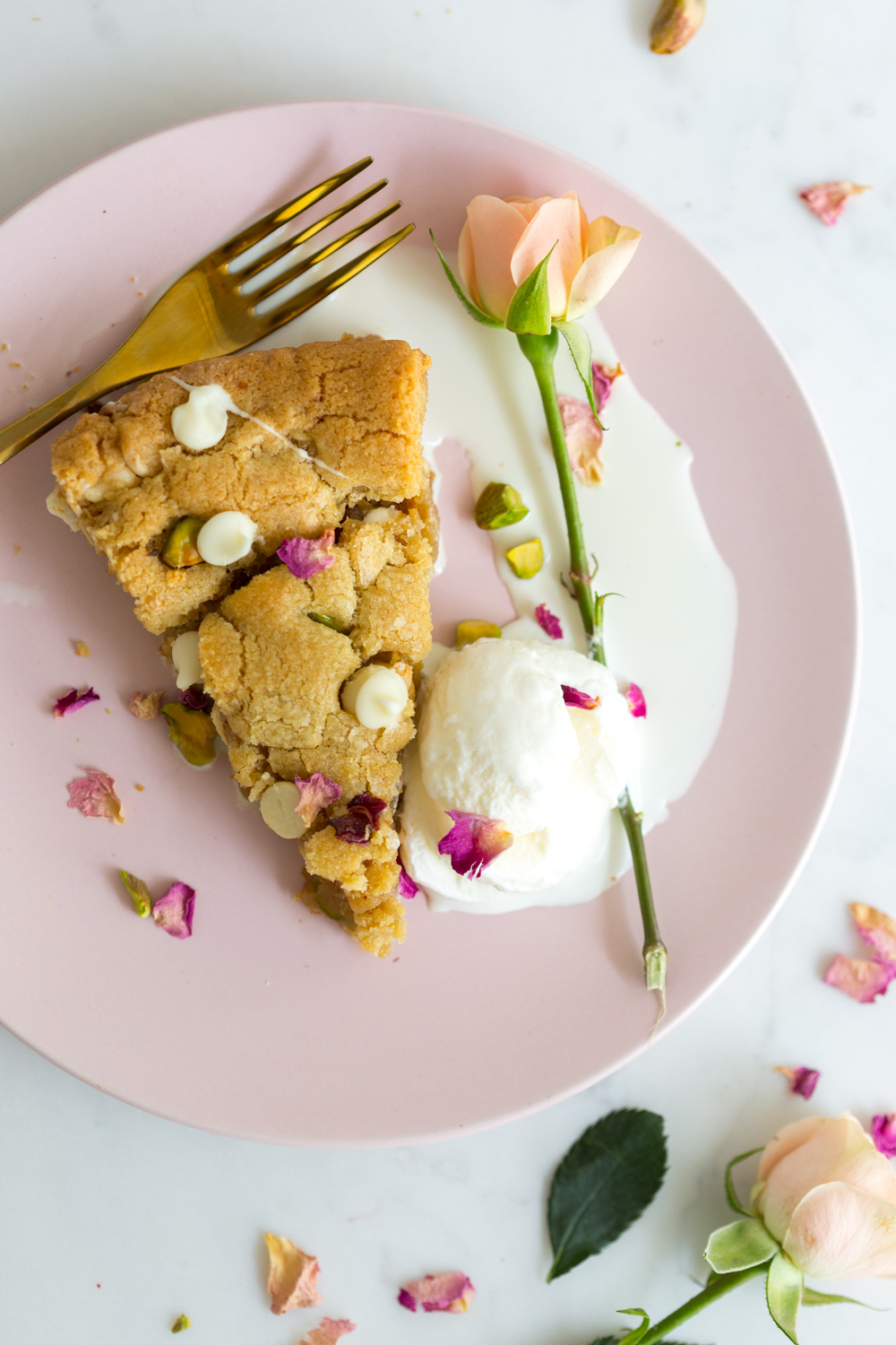 Tahini Pistachio White Chocolate Rose Skillet Cookie with ice cream