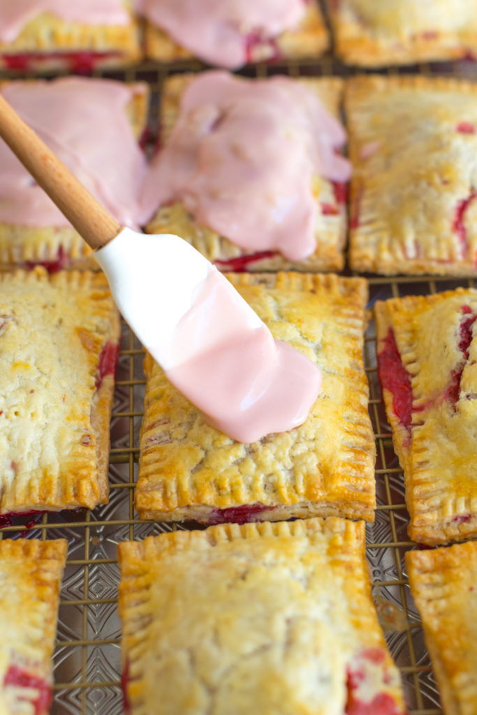 Glazing the Raspberry Rhubarb Hand Pies