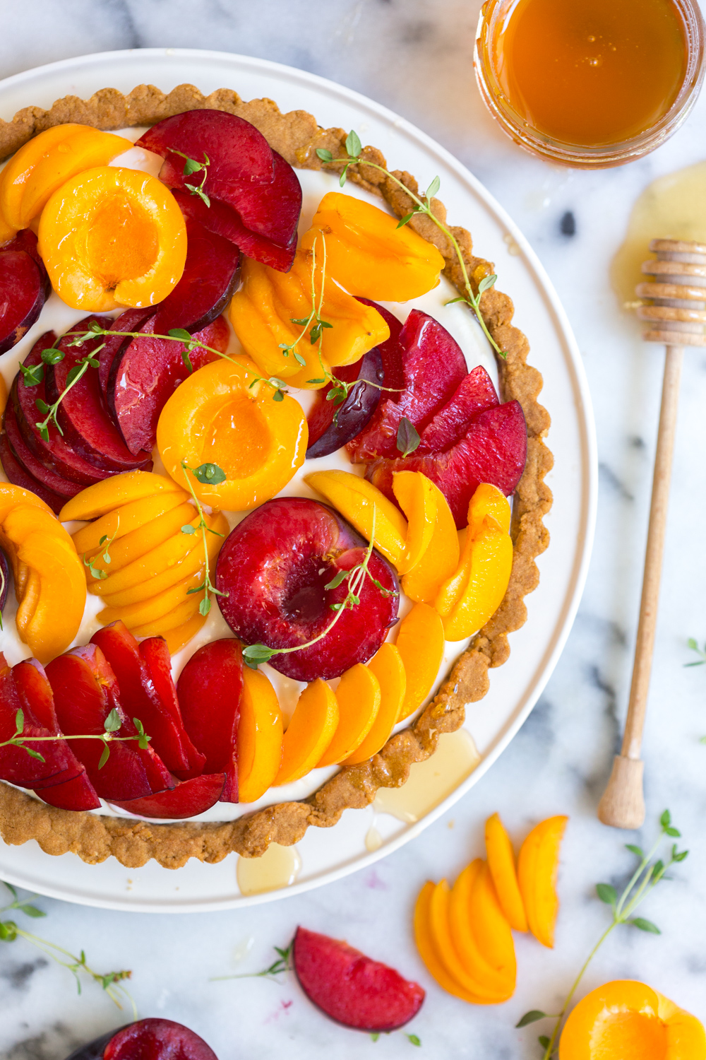 close up of the goat cheese tart with sliced apricots and plumcots on top