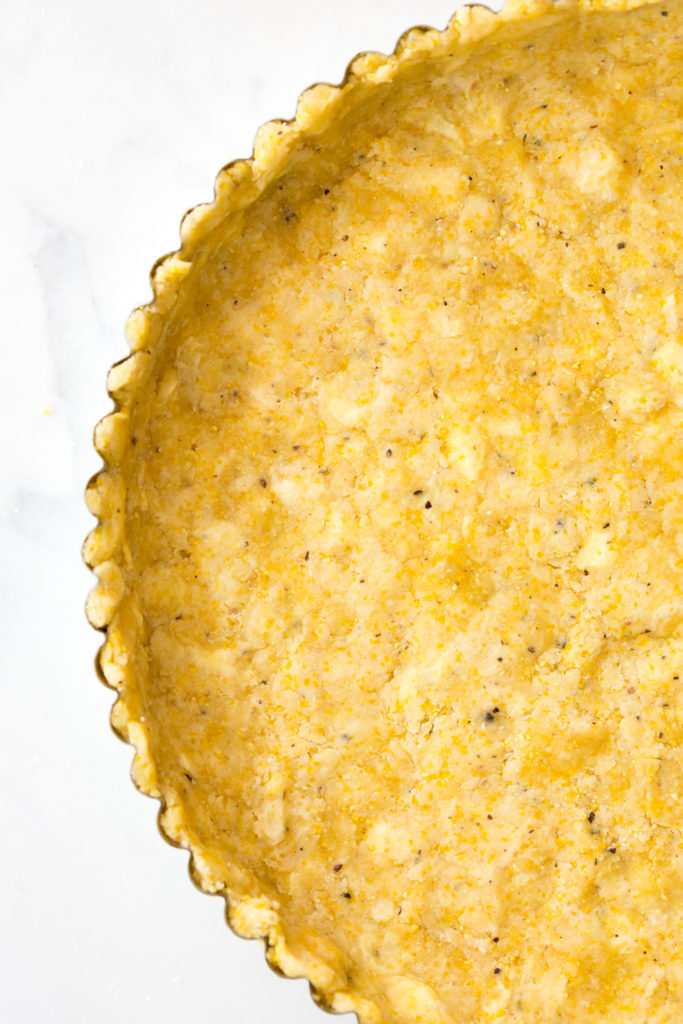 Press in Black Pepper Cornmeal Crust