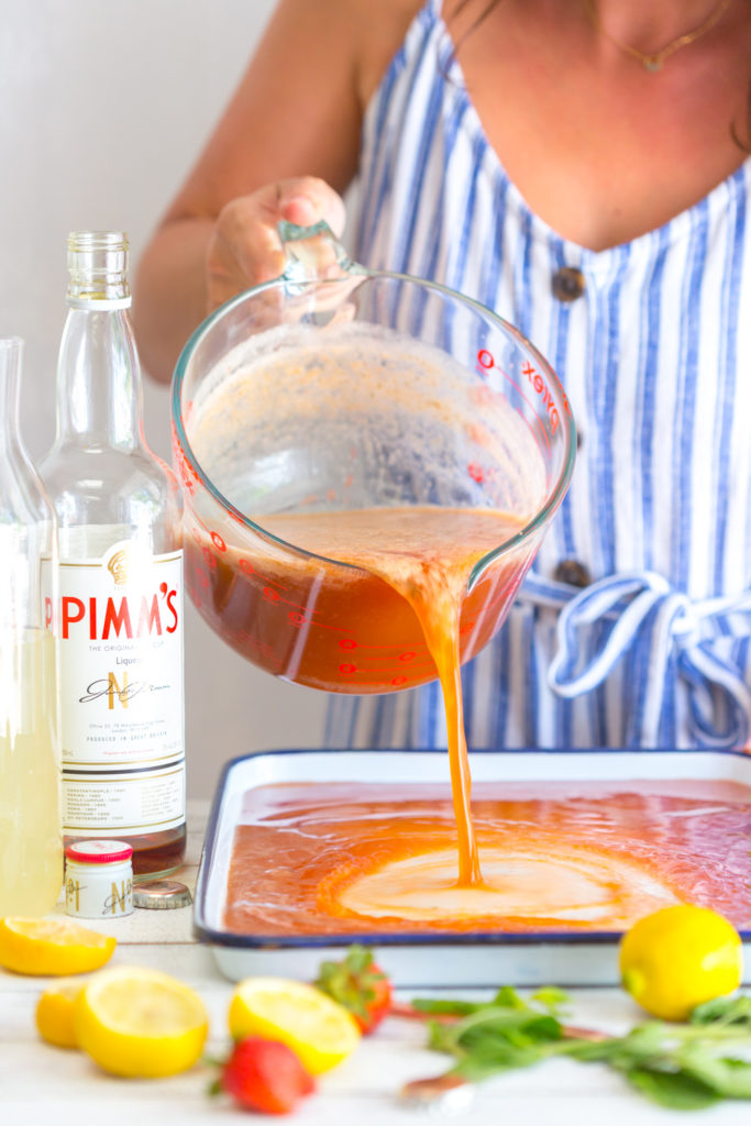 Pouring granita mix on baking sheets