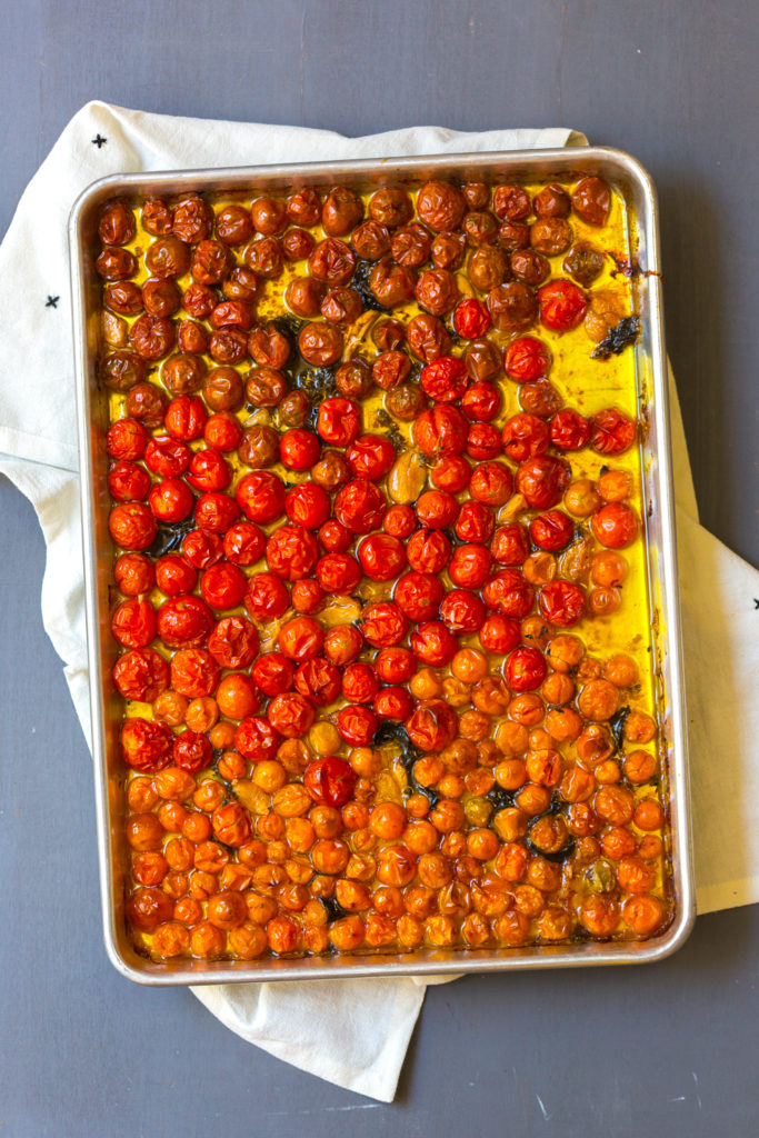 Roasted cherry tomatoes in olive oil with herbs