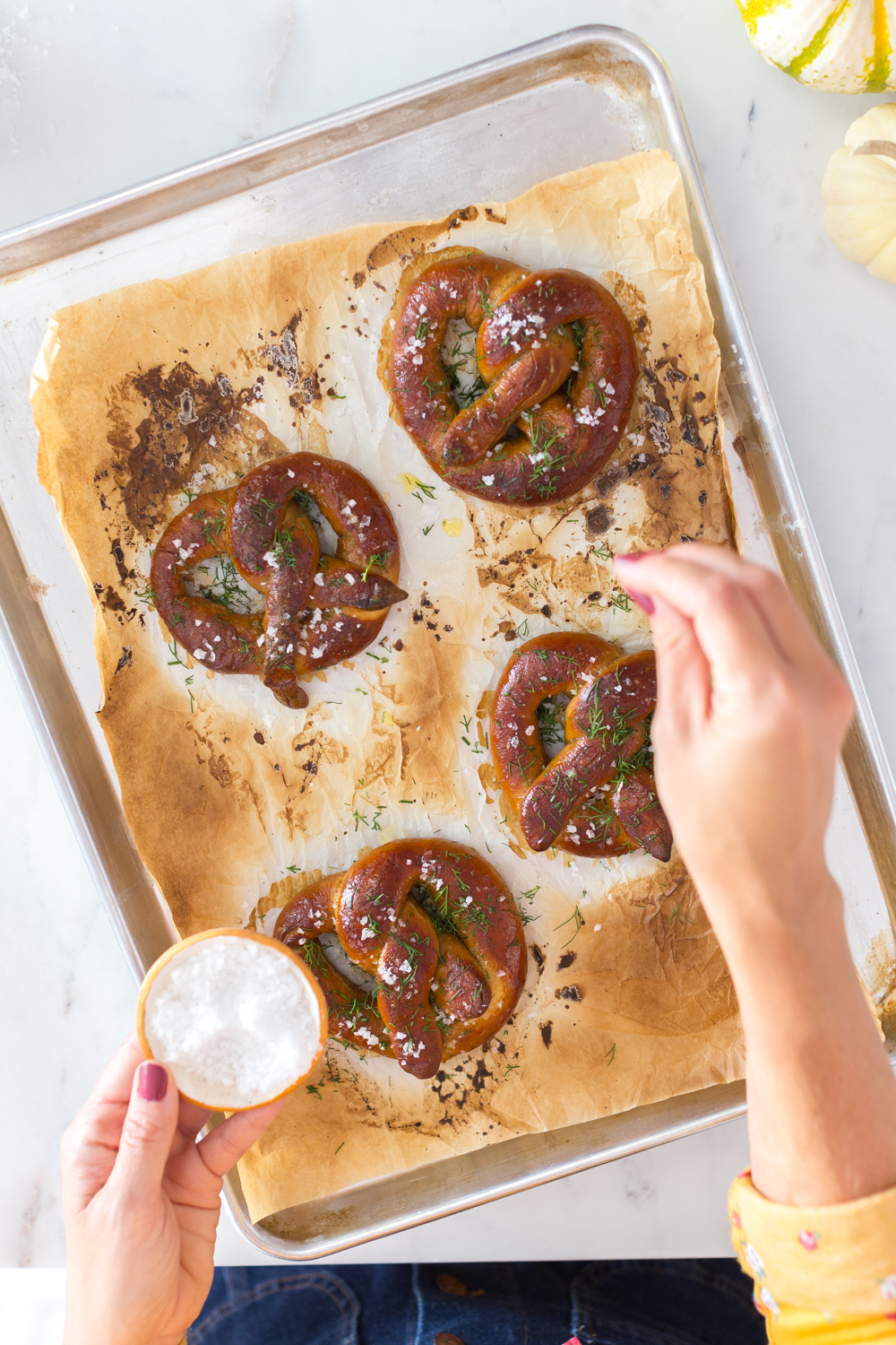 Topping the Dill Pretzels with Cider Cheese Dip