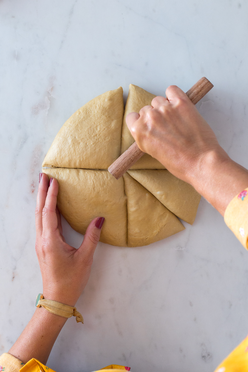 Chopping dough for Dill Pretzels with Cider Cheese Dip