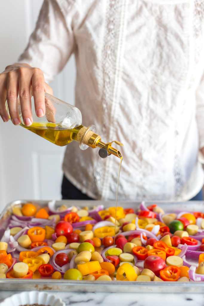 Oiling veggies for sheet pan chicken dinner