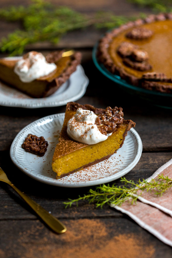 A slice of Maple Pumpkin Pie with whipped cream