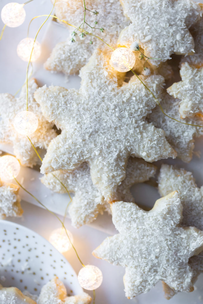 A pile of Cardamom Coconut Snowflake Cookies