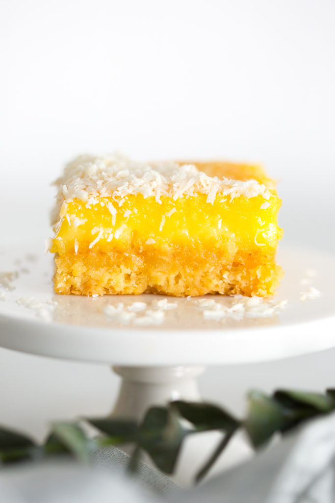 Grapefruit Coconut Bars on a pedestal