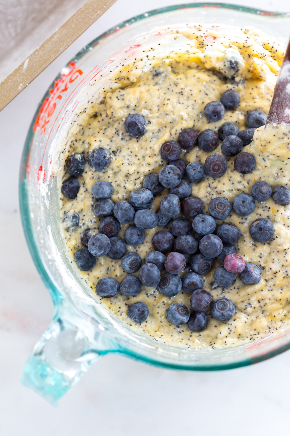 Folding in blueberries to Blueberry Poppy Seed Banana Bread