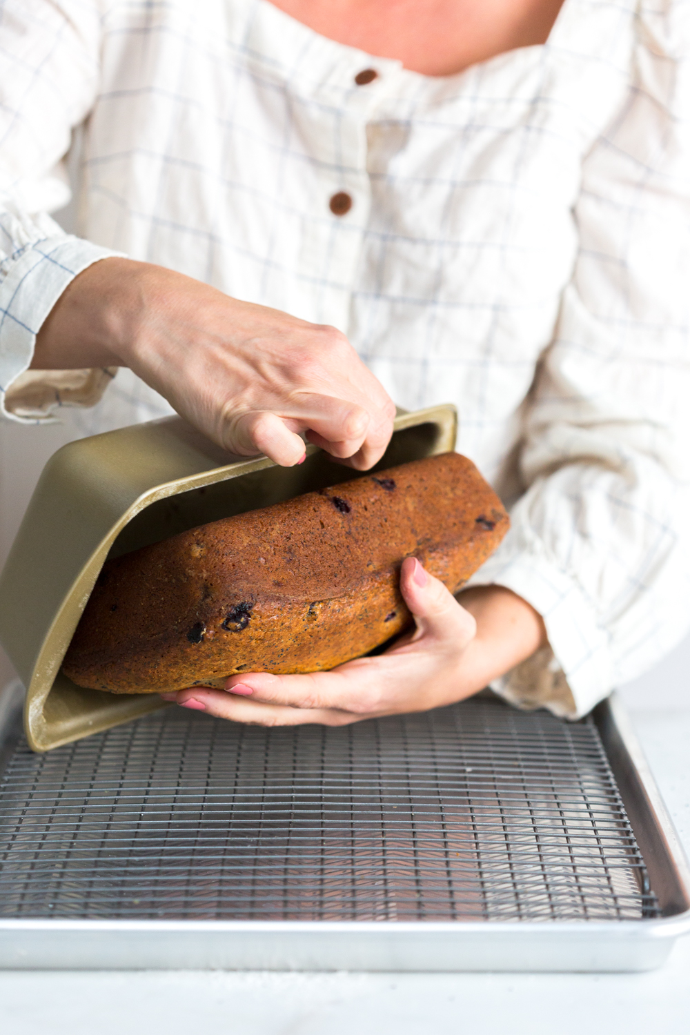 Turning out Blueberry Poppy Seed Banana Bread