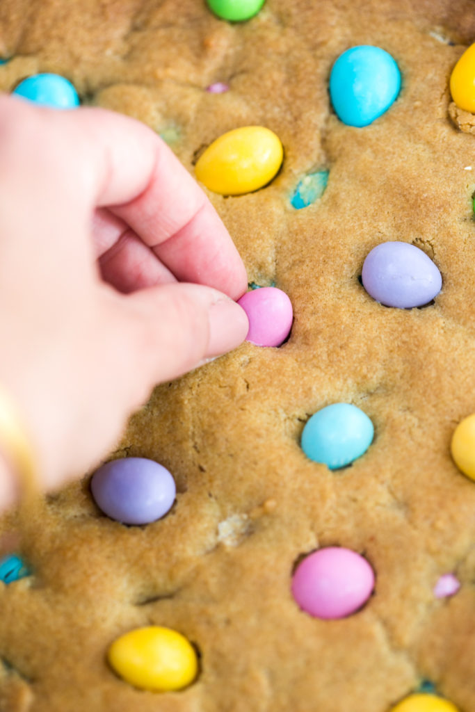 Adding Almond M&Ms to the Skillet Cookie