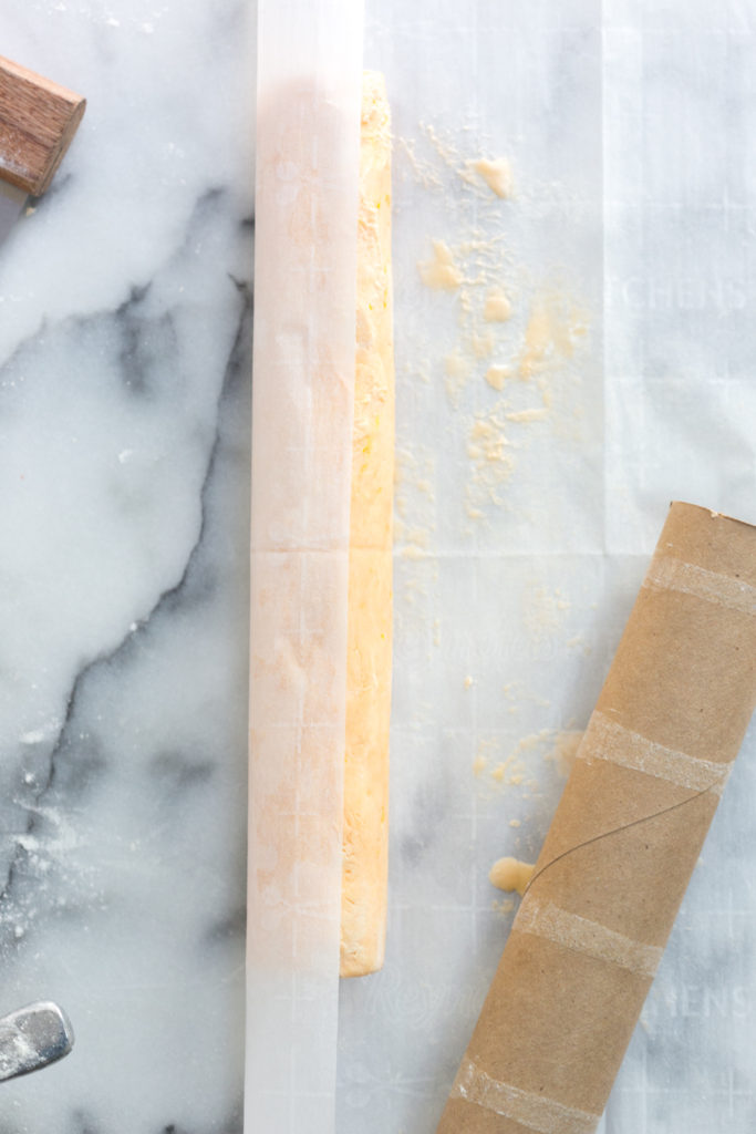 Rolling shortbread cookie dough into a log