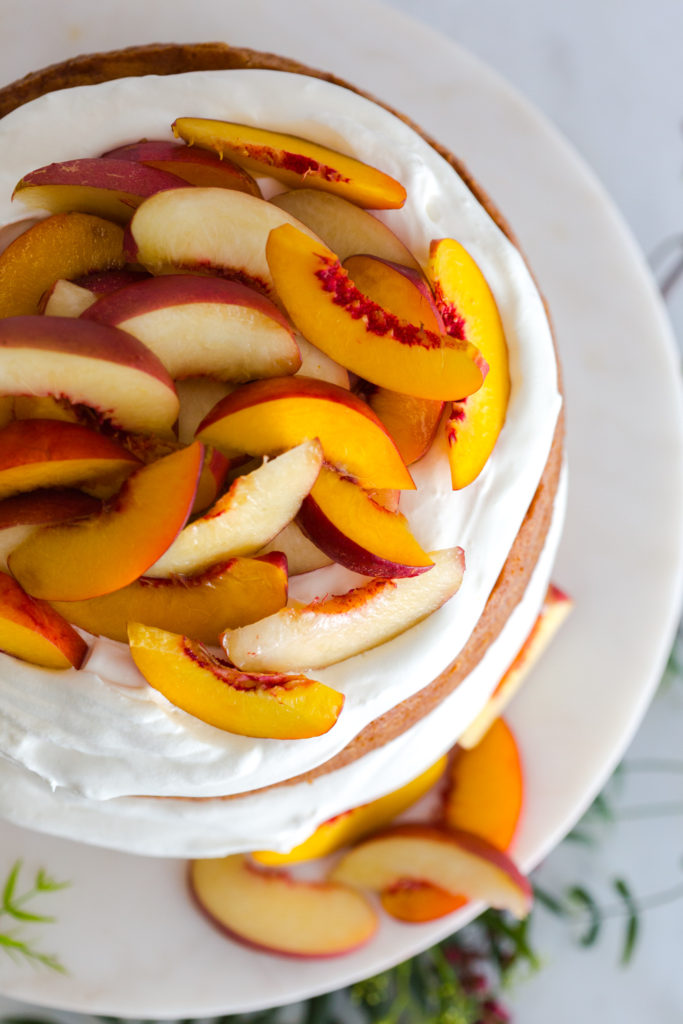 Nectarines and Creme Pink Peppercorn Honey Cake from above