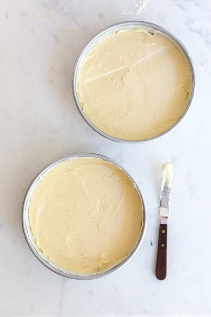 Batter filled cake pans for Pink Peppercorn Honey Cake
