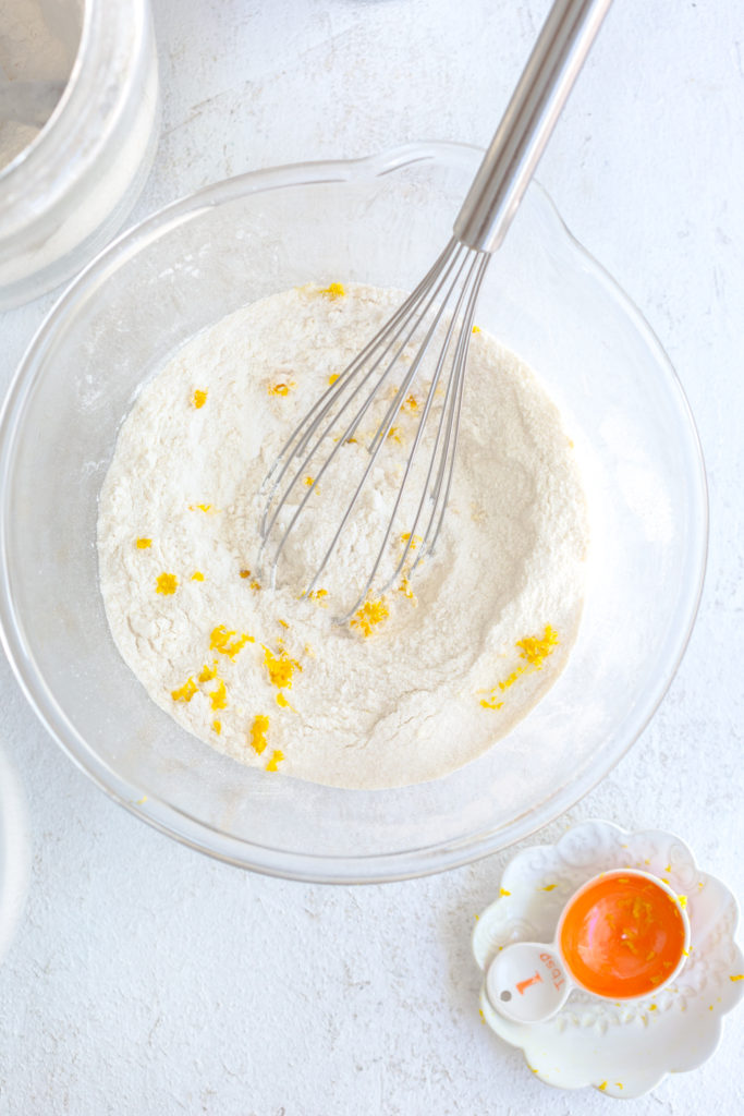 Adding orange zest to Orange Aperitivo Olive Oil Cake