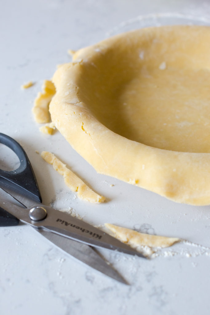 Gruyere pie dough in pie pan