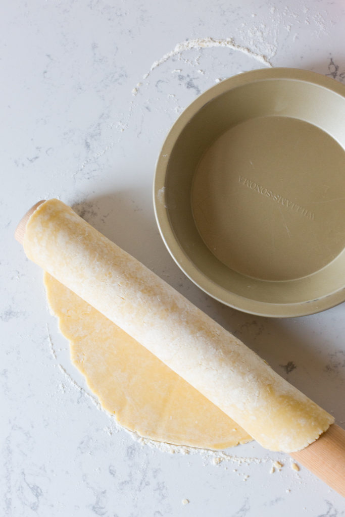 Apple Pear Gruyere Pie transferring pie dough