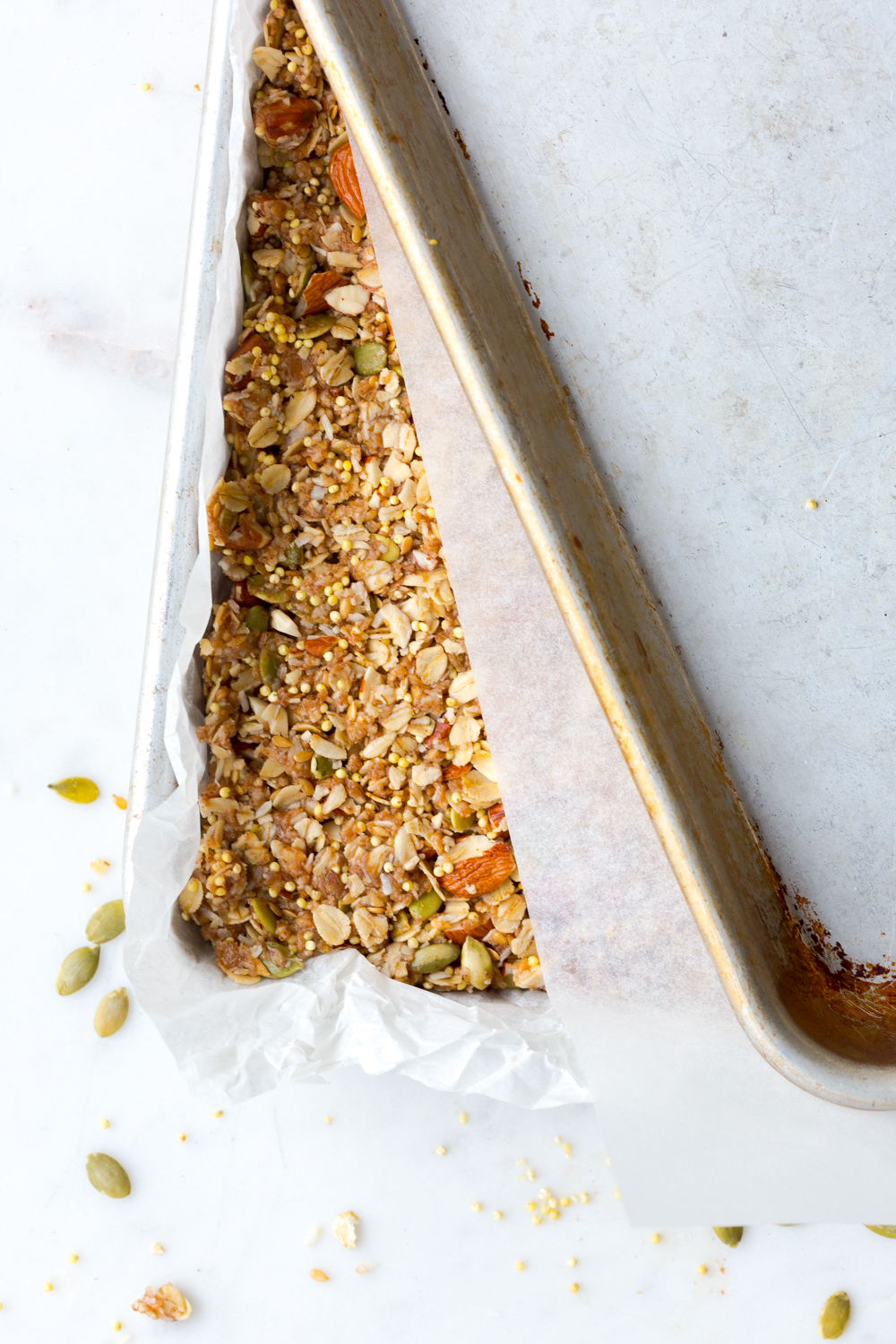 Pressing granola bars into pan