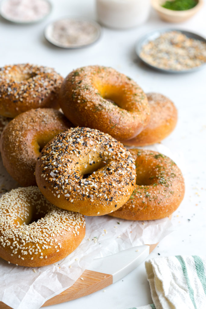 A pile of bagels by Baking The Goods.
