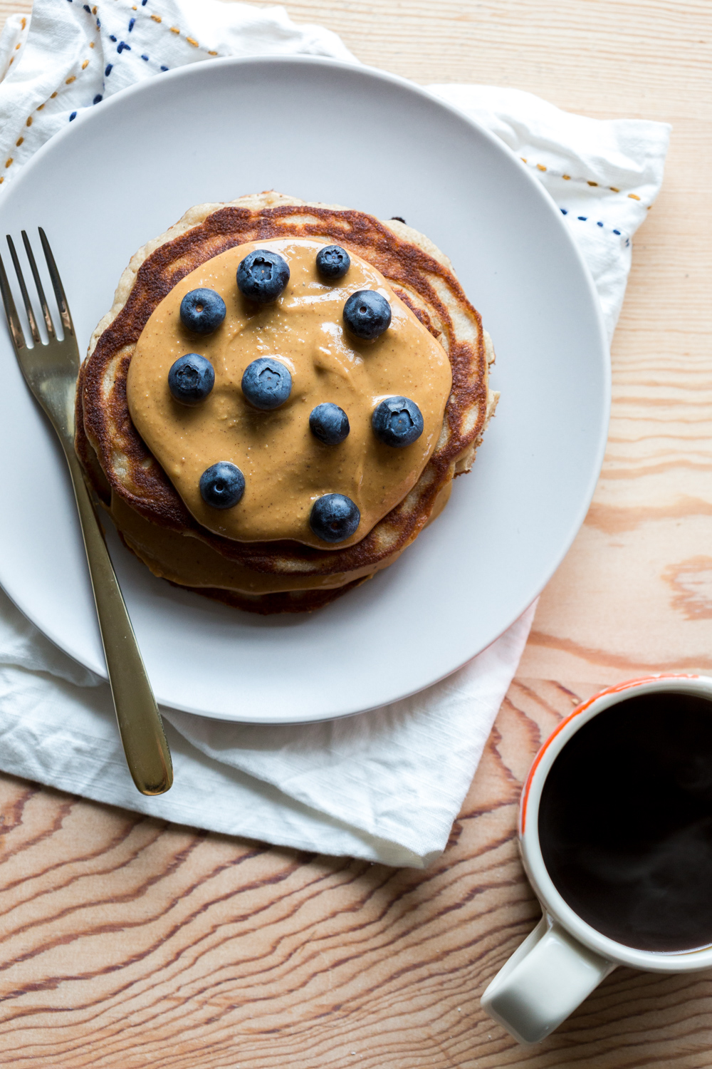 Gluten Free Almond Flour Banana Pancakes with almond butter and blueberries