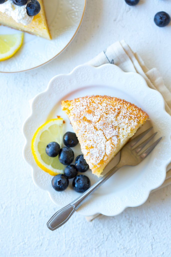 Slice of Limoncello Olive Oil Cake with blueberries