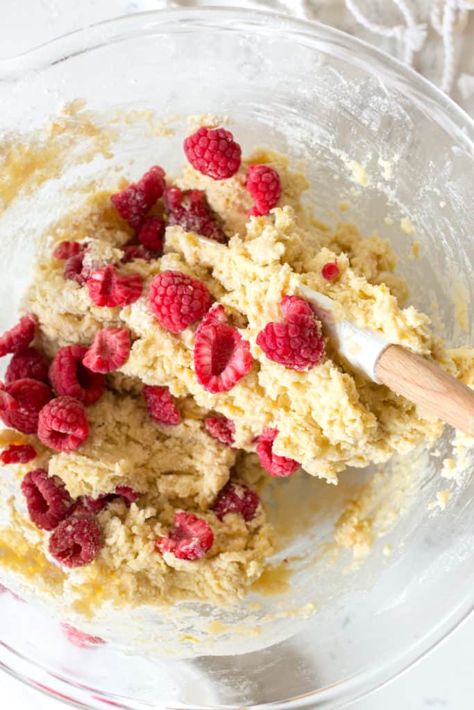 Adding raspberries scone dough