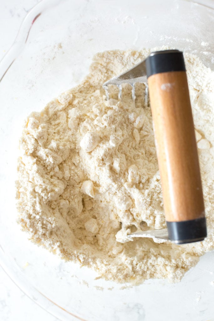 Blending scone dough with a pastry cutter