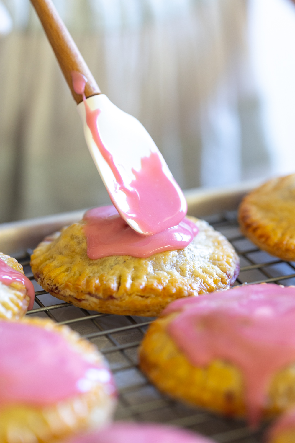 Glazing Cherry Hand Pies with Cream Cheese Crust