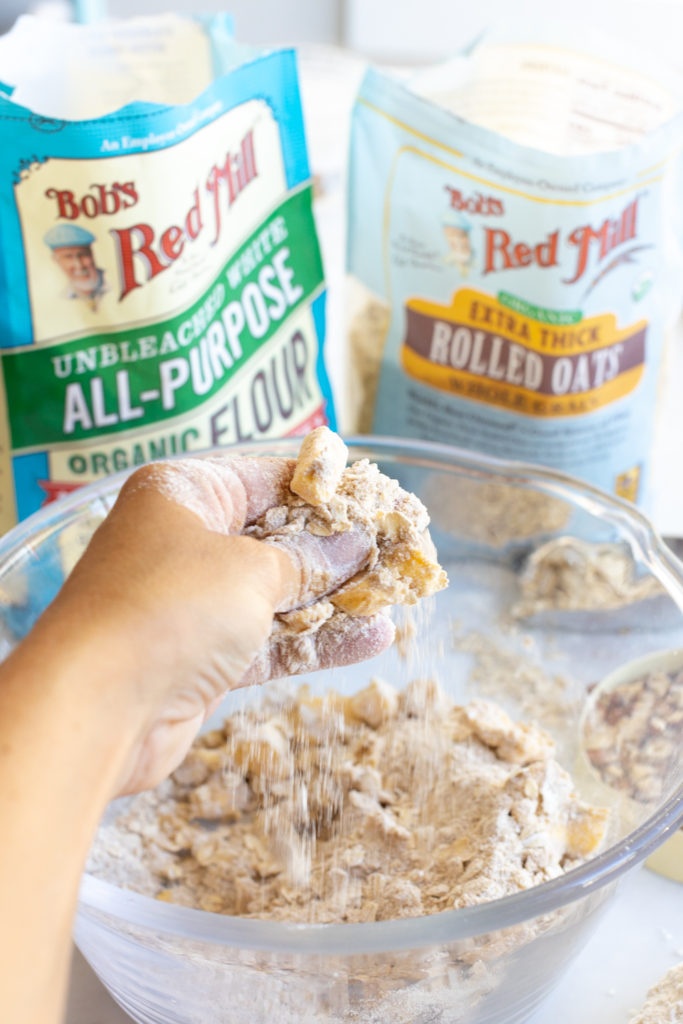 squishing hazelnut crisp topping by hand