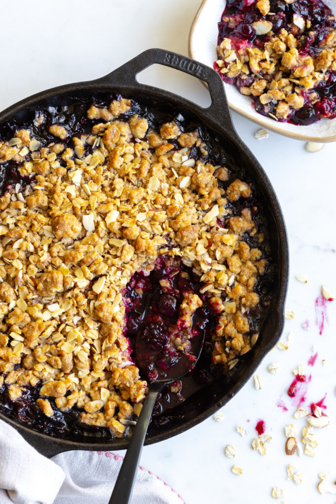 Scooping Mixed Berry Oat Almond Crisp