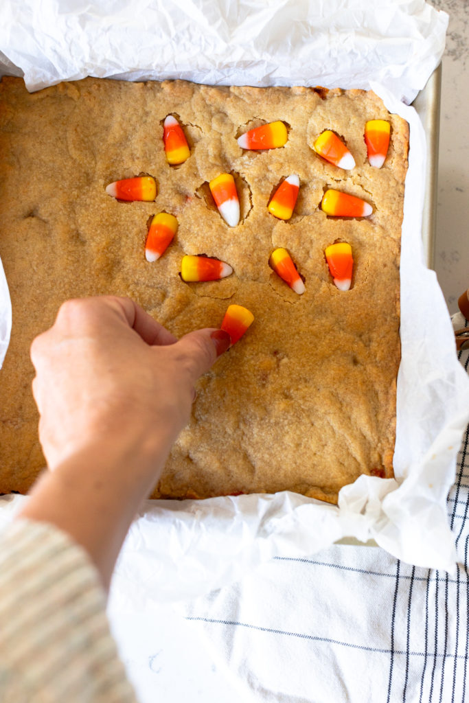 Pressing Candy Corn into Blondies