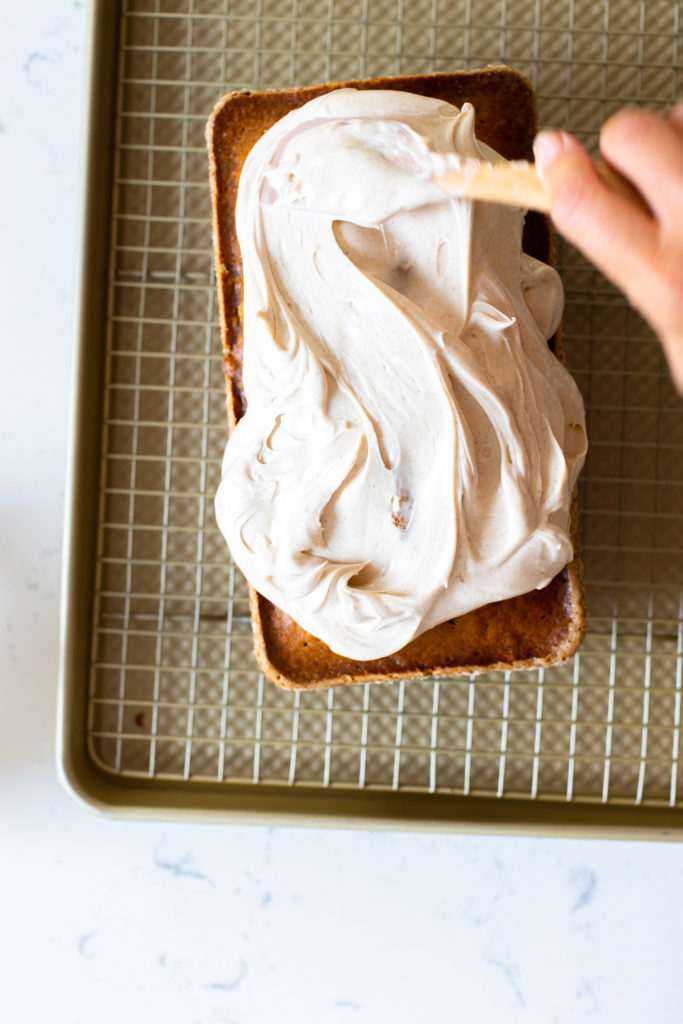 Frosting the Pumpkin Spice Bread with Maple Cream Cheese Frosting