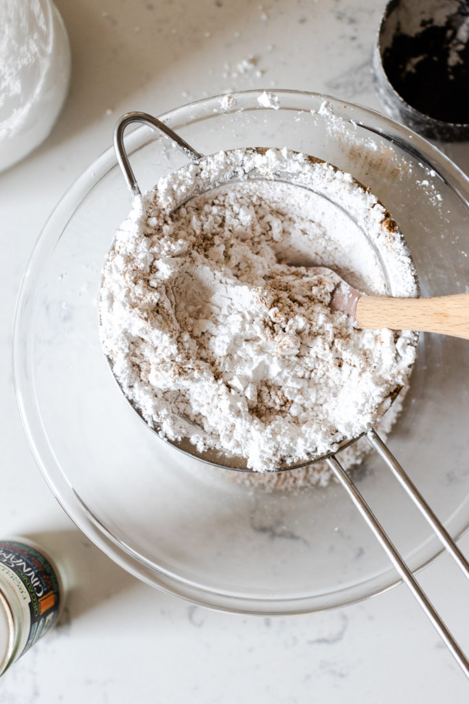 sifting powdered sugar and cinnamon