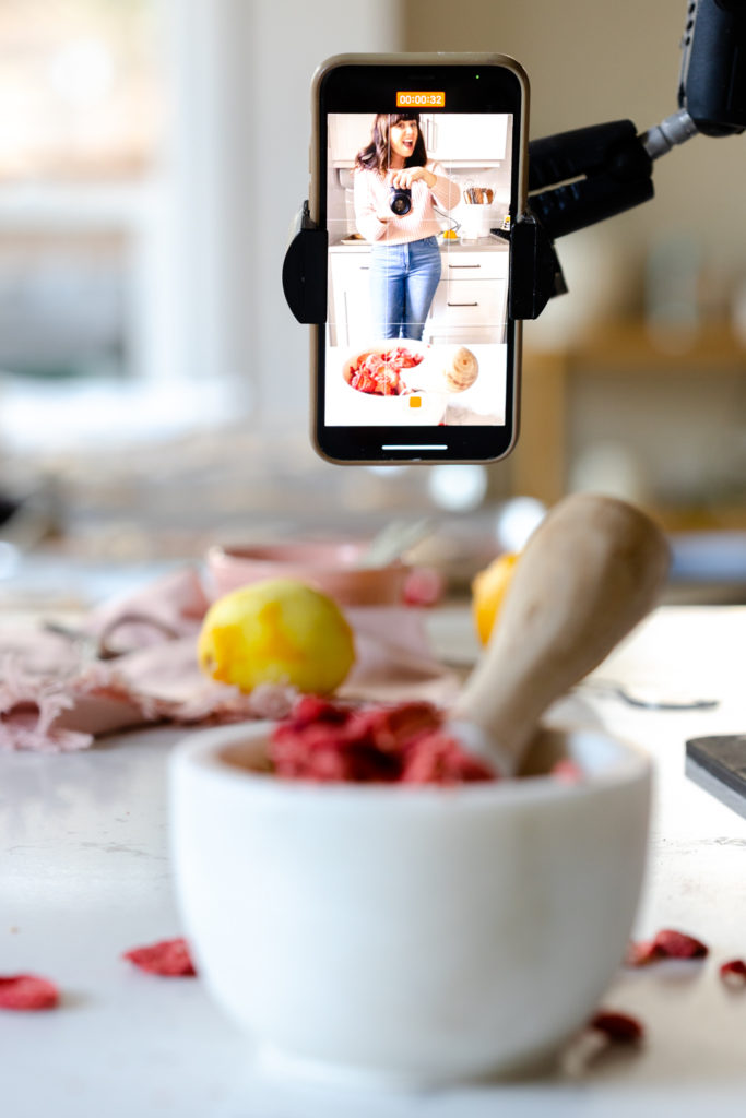 Becky Sue of Baking The Goods making Glazed Strawberry Lemon Heart Cookies