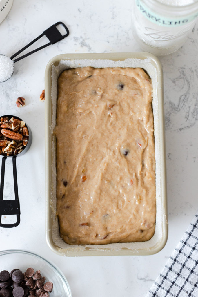 Brown Butter Pecan Chocolate Chip Banana Bread batter in pan